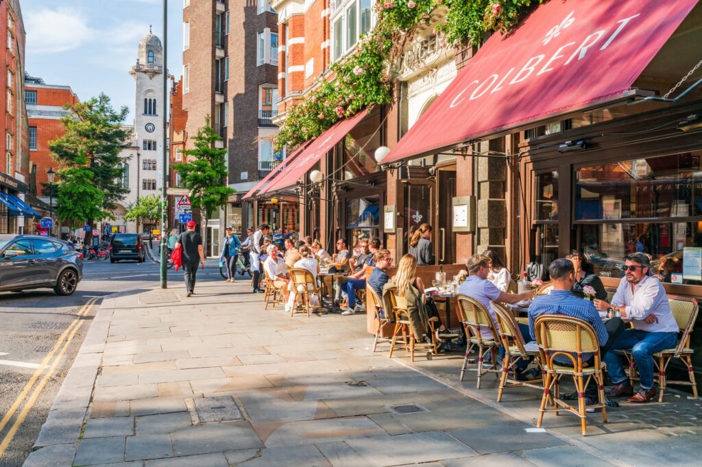 A busy street full of diners