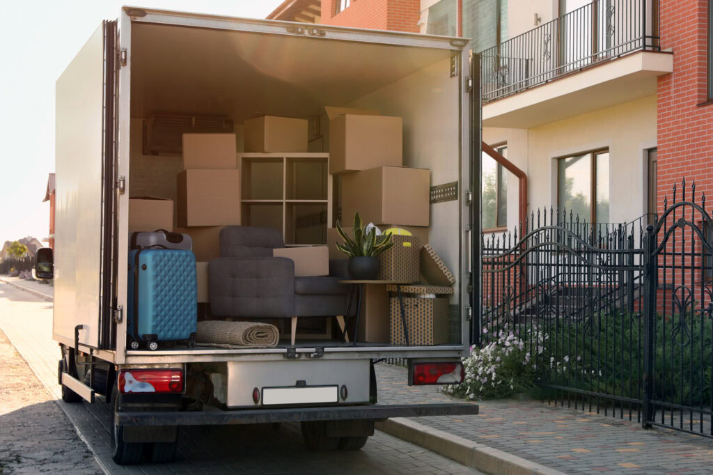 van filled with furniture and other items for moving